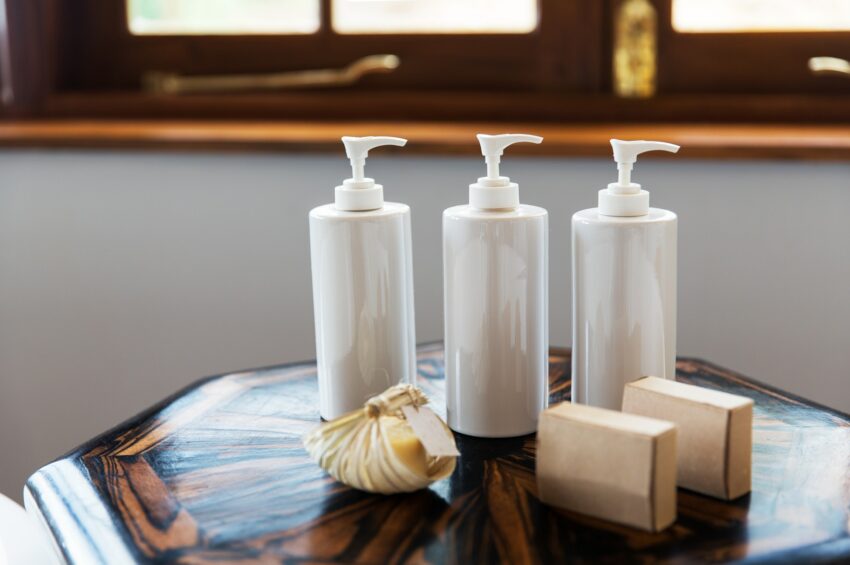 bottles with liquid soap or lotion at spa