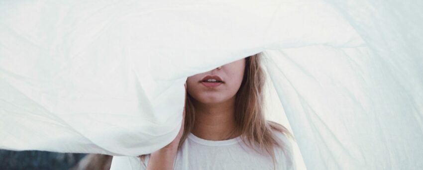 woman under white cloth